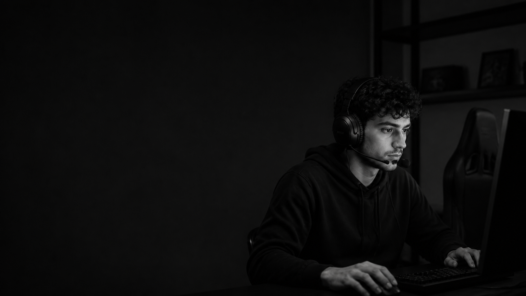 A focused competitive player at their gaming setup
